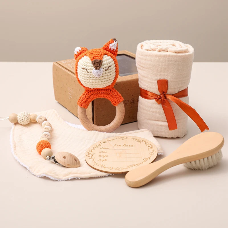 Hagamos el juego de regalos para bebés: elementos esenciales reflexivos en una caja adorable