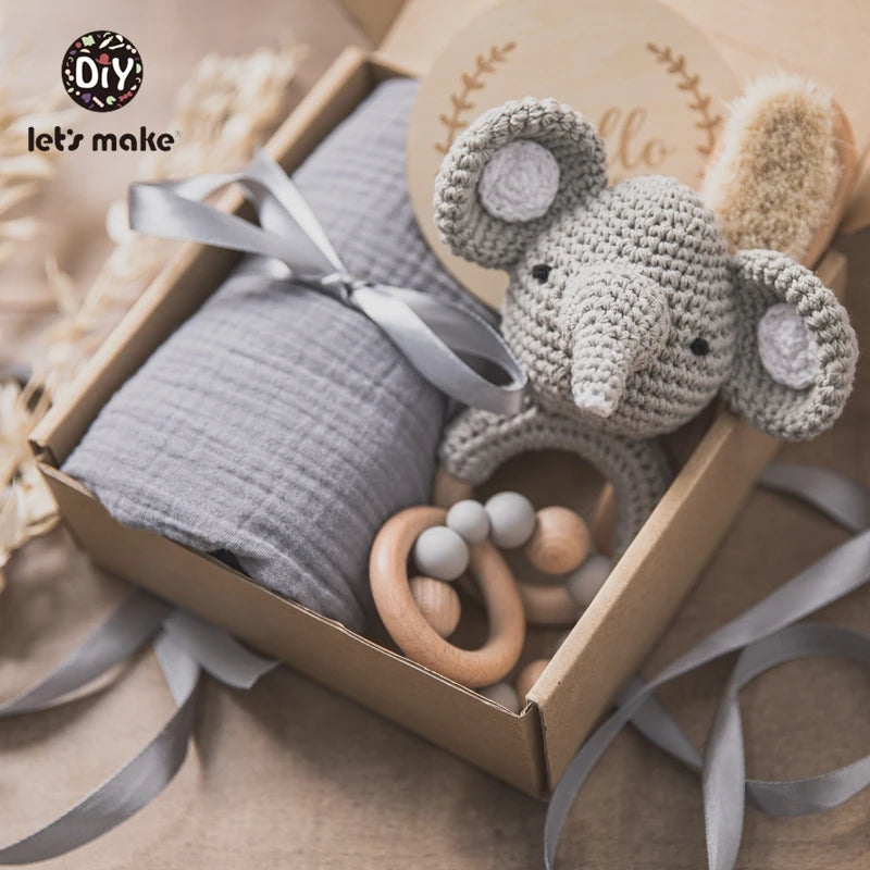 Hagamos el juego de regalos para bebés: elementos esenciales reflexivos en una caja adorable
