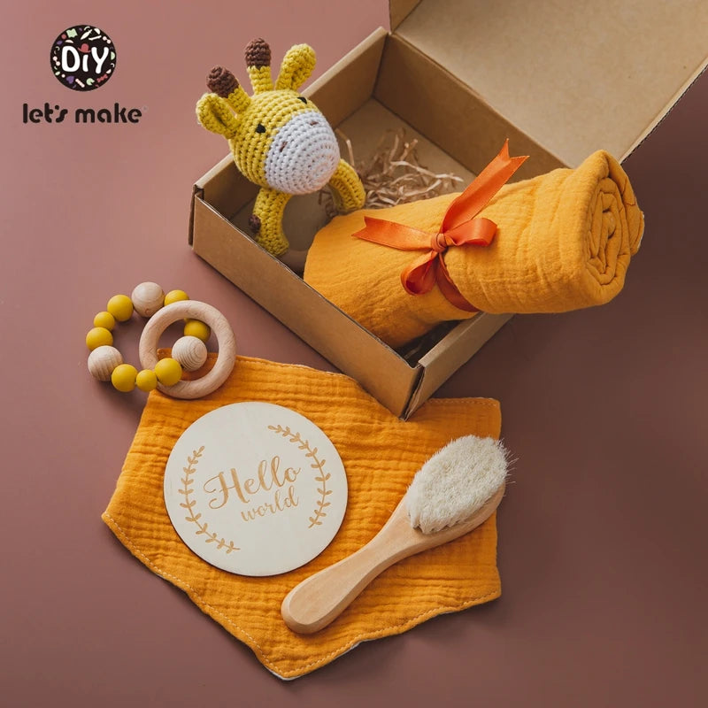Hagamos el juego de regalos para bebés: elementos esenciales reflexivos en una caja adorable