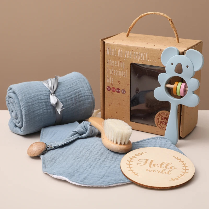 Hagamos el juego de regalos para bebés: elementos esenciales reflexivos en una caja adorable