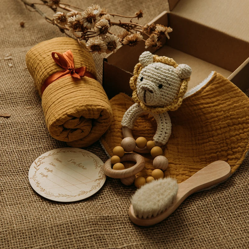 Hagamos el juego de regalos para bebés: elementos esenciales reflexivos en una caja adorable