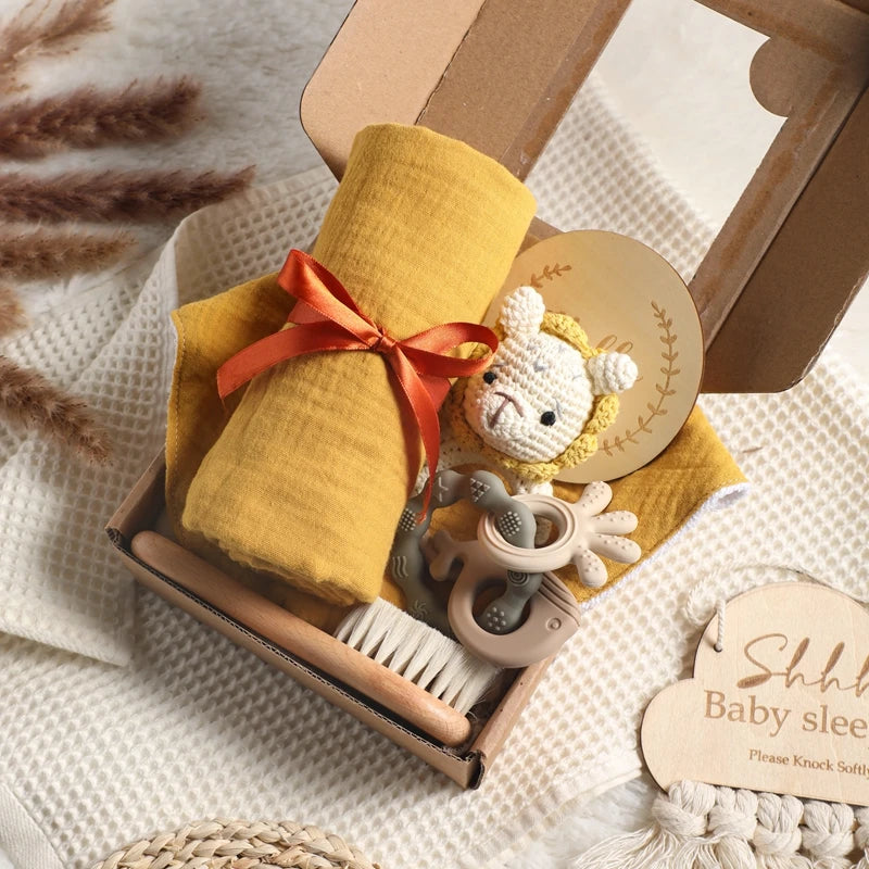 Hagamos el juego de regalos para bebés: elementos esenciales reflexivos en una caja adorable