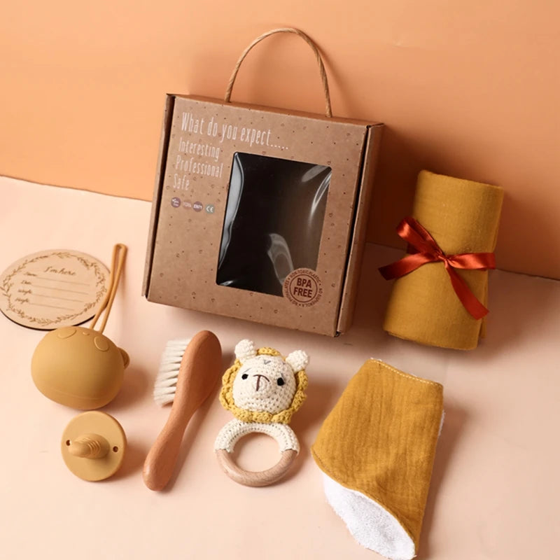 Hagamos el juego de regalos para bebés: elementos esenciales reflexivos en una caja adorable