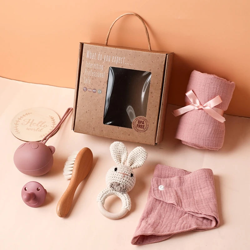 Hagamos el juego de regalos para bebés: elementos esenciales reflexivos en una caja adorable