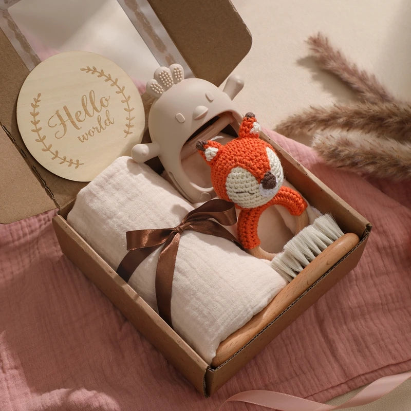 Hagamos el juego de regalos para bebés: elementos esenciales reflexivos en una caja adorable
