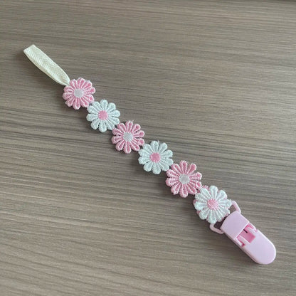 Chaîne de tétine de bébé avec clip de marguerite