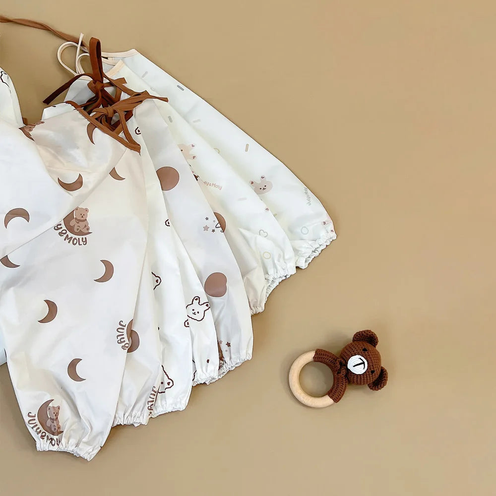 Bib con le maniche da nutrire per bambini a copertura piena 