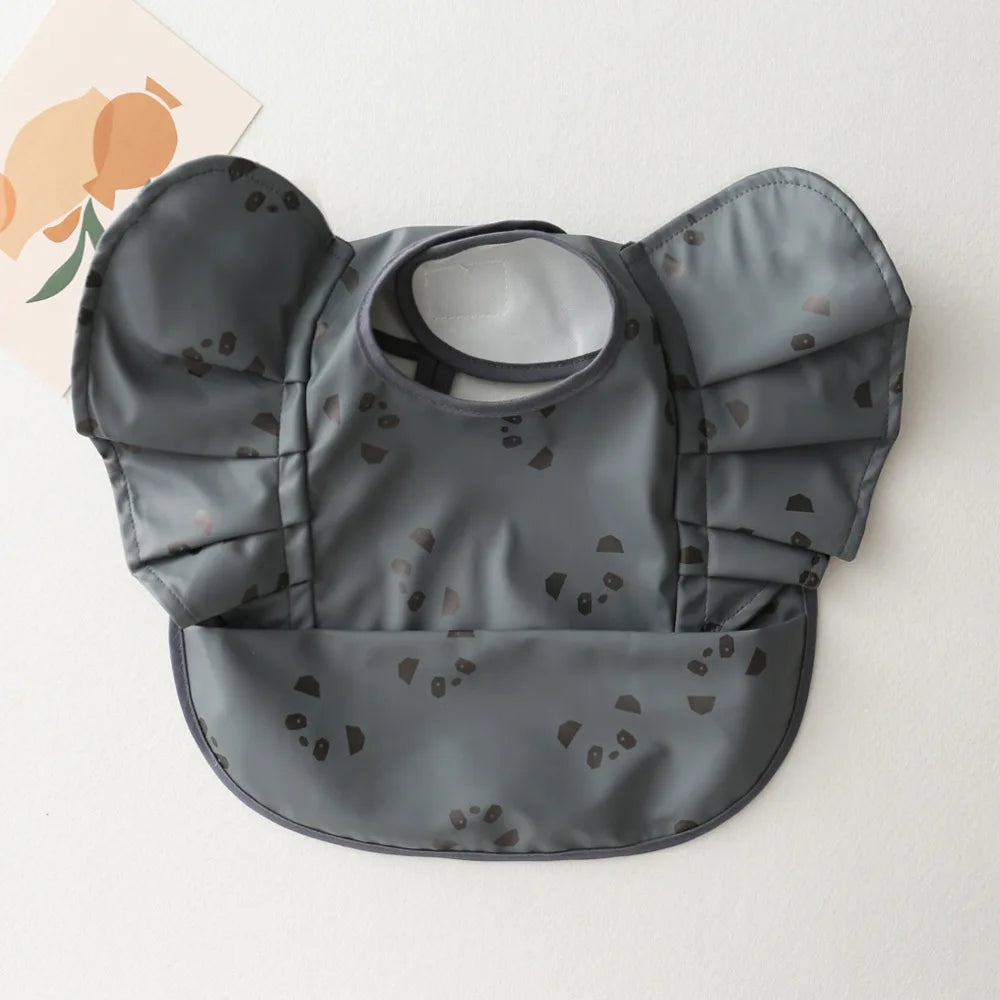 Eleganti bavaglini in silicone con maniche arruffate