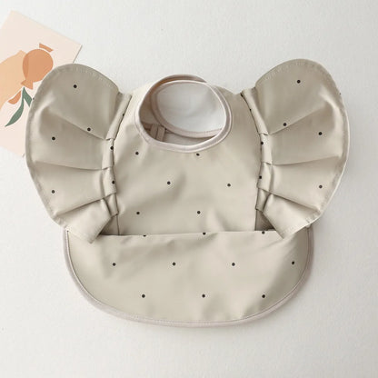 Eleganti bavaglini in silicone con maniche arruffate